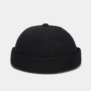 Detailed view of a black cotton miki hat featuring a rolled edge and classic retro worker style