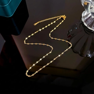 Detail of gold-plated stainless steel sequin lip chain with lobster clasp and extender