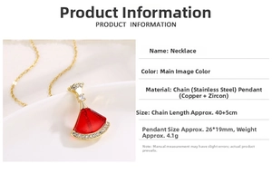 Detail view of red fan-shaped necklace pendant with zircon pavé setting on golden chain