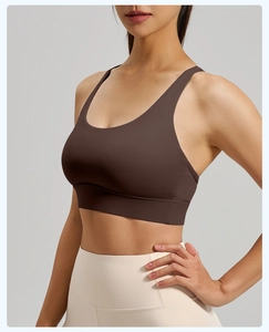 Detail view of brown cross-back sports bra with high-elasticity mesh fabric