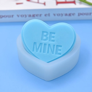 Detail of heart silicone mold with Be Mine text for DIY chocolate mousse cake baking