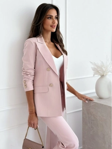 Detail of pink double-breasted blazer with gold buttons and refined woven texture