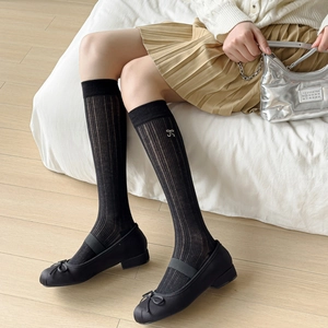 Japanese style black slouch socks with ribbon embroidery paired with ballet flats