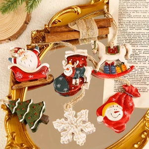 Set of 6 vintage resin Christmas ornaments including Santa and reindeer on a gold mirror