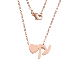 Detail of rose gold stainless steel heart necklace with cursive letter P pendant
