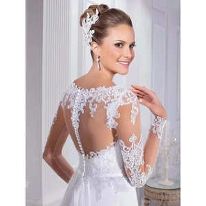 Exquisite back detail of a white mermaid wedding dress with sheer lace and floral appliques