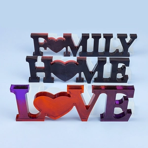 Detail of HOME FAMILY LOVE resin molds and colorful letter ornaments with hearts