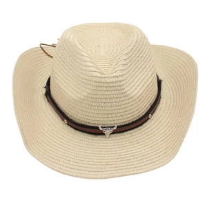 Detail of straw cowboy hat with brown leather band and silver bull head metal ornament
