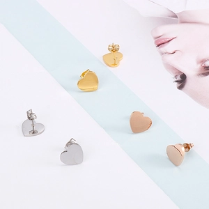 Three pairs of heart-shaped titanium steel stud earrings in gold, silver, and rose gold