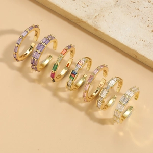 Set of seven adjustable gold rings with colorful rectangular zircon stones in various hues