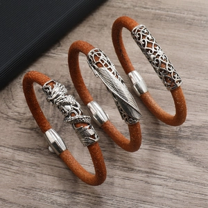 Vintage brown leather bracelets for men with dragon, feather and floral patterns