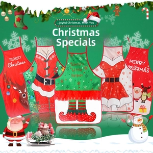 Detail view of five assorted Christmas aprons with reindeer and Santa Claus festive patterns