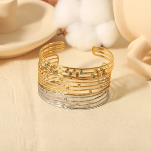 Bracciale rigido multistrato in oro 18K e argento traforato con zirconi colorati