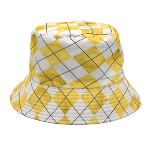 Close-up of yellow and white diamond checkered bucket hat with detailed geometric pattern
