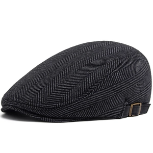 Men's wool herringbone ivy cap in black and grey with adjustable metal side buckle