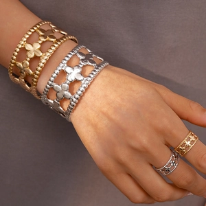 Two-piece floral hollow open cuff bracelets and rings set in gold and silver finish