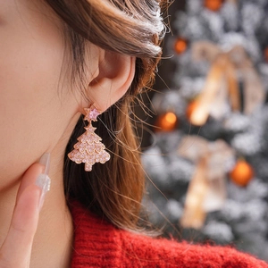 Sparkling Christmas tree drop earrings with pink zircons and stars for a festive look