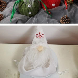 Detail of Christmas gnome candy bags showing knitted texture and snowflake embroidery