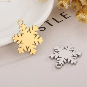 Detailed view of gold and silver snowflake pendants for Christmas DIY jewelry making