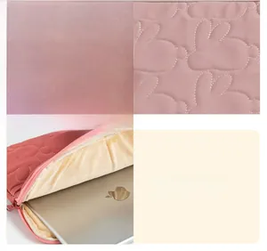 Detail of pink quilted tablet sleeve with plush lining and smooth zipper closure