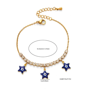 Detail of gold chain bracelet with blue evil eye star pendants and clear rhinestones