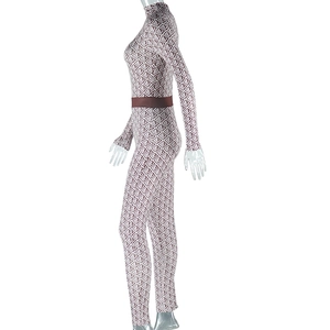 Detail of geometric rhombus pattern on brown and white long sleeve bodycon jumpsuit