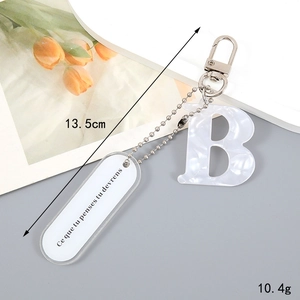 Detailed view of 13.5cm alphabet 'B' keychain with marble texture and size labels