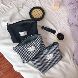 Three-piece urban cotton makeup bag set featuring black canvas and checkered patterns
