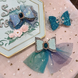 Three blue princess bow hair clips with snowflake and jewel accents for girls