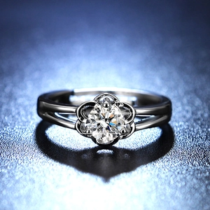 Macro detail of one-carat moissanite ring with flower-shaped six-prong setting