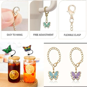 Detail view of butterfly straw covers with adjustable golden metal chains and charms