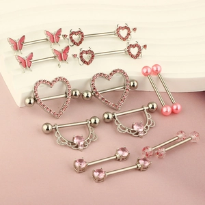 Pink zircon nipple ring set in heart and butterfly designs made of stainless steel