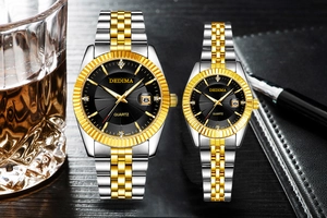 Business style couple watch set with luminous calendar on dark table with luxury items