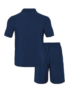 Rear view of navy blue waffle knit polo shirt and drawstring shorts two-piece set