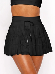 Detail of black tiered lace mini skirt with adjustable drawstring and metal tips