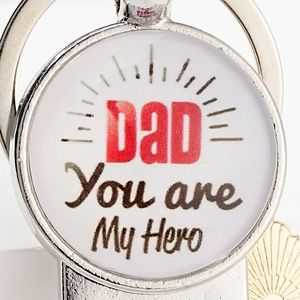 Detail of metal beer keychain with DAD You Are My Hero engraving for Father's Day
