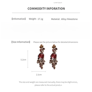 Detail card of vintage leaf earrings with red rhinestones showing weight and size specs