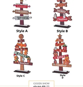 Detailed view of four assorted wooden Christmas tabletop signs with festive motifs