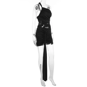 Detail of black one-shoulder ruched dress showing elastic fabric and side drape design