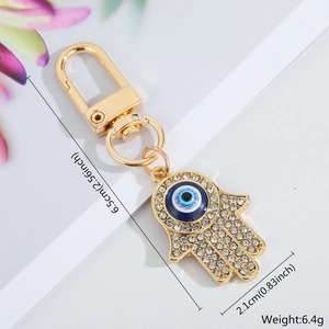 Detail view of Hamsa Hand keychain with dimensions 6.5cm length and 6.4g weight