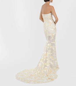 Detailed back view of white strapless mermaid gown with lace embroidery and long train