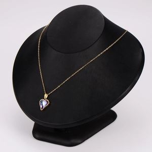 Fashion golden necklace set with purple heart crystal pendant on black mannequin display