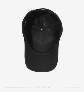Detail view of cotton and tencel fabric blend interior lining on a black baseball cap