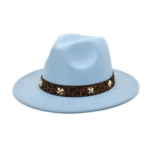 Close-up of light blue wool fedora featuring a leopard print band and metal cross buckle