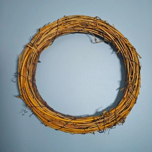 Natural round handmade wicker wreath for Christmas floral decoration and DIY crafts