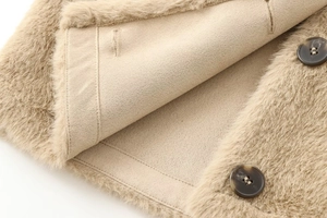 Close-up of beige faux fur texture with high-quality resin button detail and fine stitching