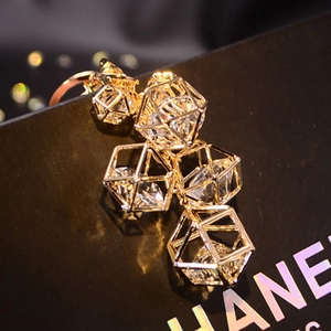 Prism crystal ball keychain with golden geometric frame for handbags and car keys