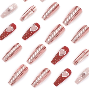 Long ballerina press-on nails with red heart patterns, silver glitter and Christmas motifs
