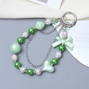 Acrylic green heart and bow beaded phone charm with white rhinestone balls and silver chain
