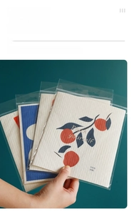 Detail of individually wrapped wood pulp cotton sponge with cute orange print